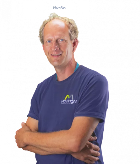 Moreno, holding a white helmet and a hammer