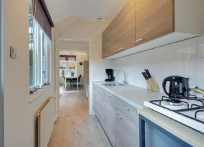 Fully equipped kitchen with stove, microwave & sink