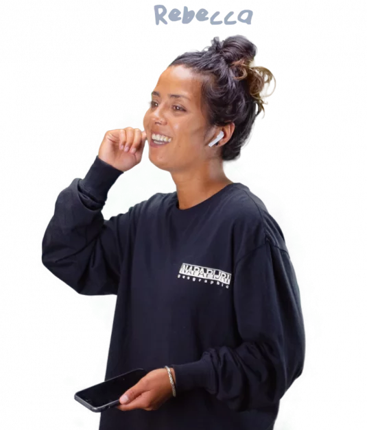 Rebecca holding a phone while calling